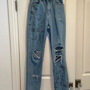 Ripped, patterned jeans